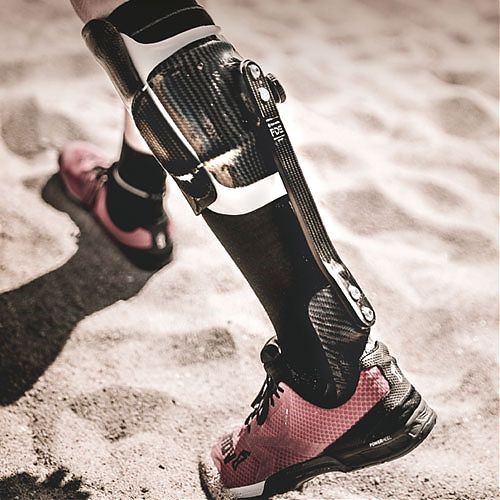 Image of person's leg with the Reactiv Brace in the sand